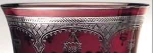 Arpeggio pattern detail in platinum in cased crystal by Crystallerie de Montbronn, shown in deep red